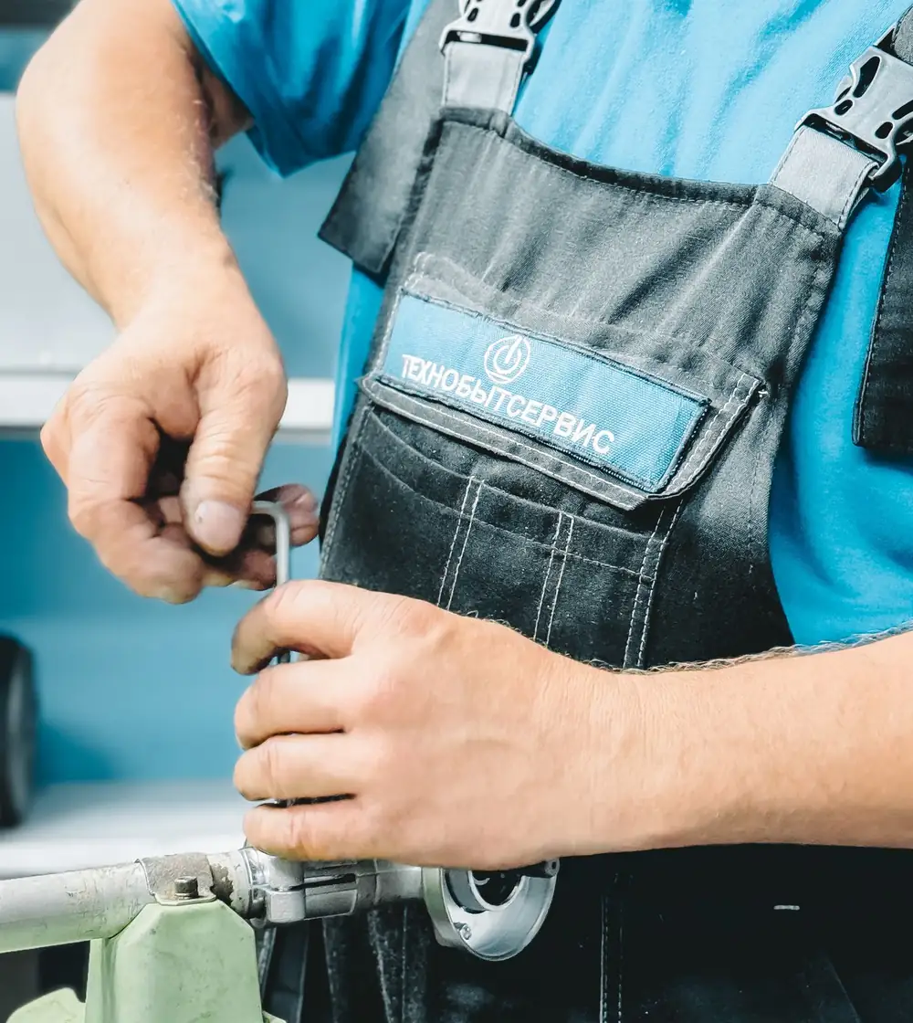 A plumbing repair using a wrench and pipe fitting