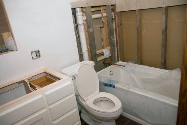 Bathroom plumbing pipes installed behind walls during renovation