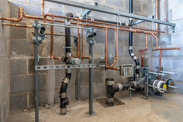 Commercial plumbing pipes and fixtures installed in a building