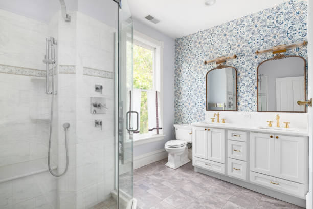 Modern bathroom with shower, bathtub, toilet and double vanity